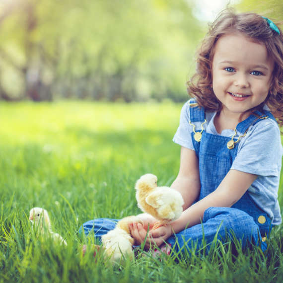 child sitting on the lawn